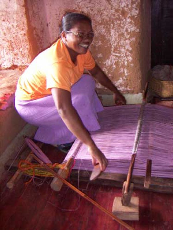 7. She sets up the piece and starts weaving. The handlooms are made by the men in the village. A handloom lasts for some 15 years. 