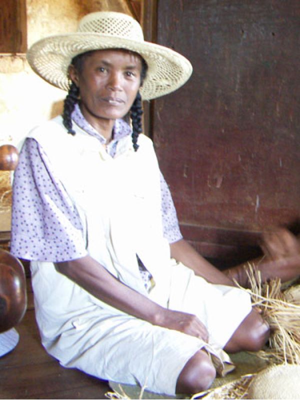 3. Mme Odette is one of three sisters who together braid hats and bags.